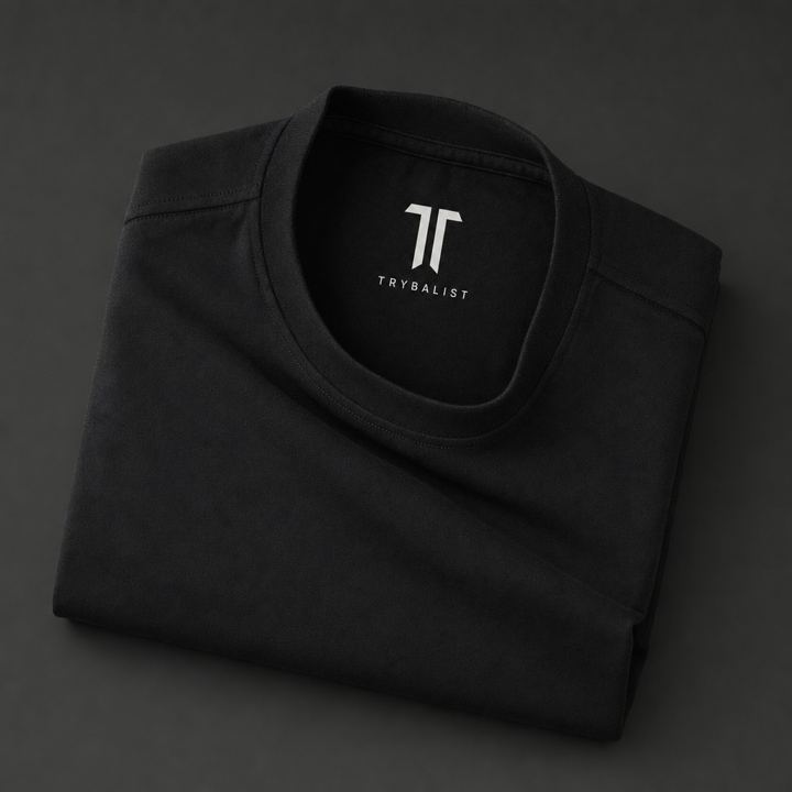 The Standard Tee, folded flat on concrete